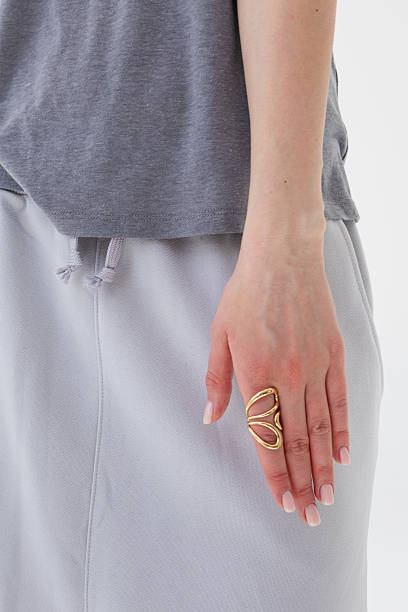 Female hands with rings on their hands close-up. Vertical photo. High quality photo