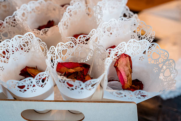 Dried red rose petal wedding confetti in paper cones