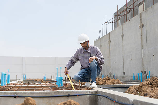 istock Construction site. Building foundation structure. Civil engineer. Network of pipes. Construction engineer supervising construction work at construction site. Plumber working in sewer pipes area 2224079026