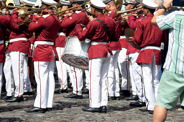 Salvador, Bahia, Brazil - July 02, 2025: Public school students are seen playing a musical instrument during a Bahia independence civic parade in Pelourinho, Salvador, Brazil.