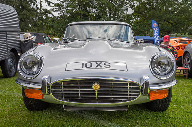 Little Gransden, Cambridgeshire, England - August 27, 2023: Classic E-type  Jaguar Cars parked on grass