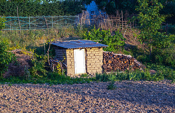 istock A small house in the middle of a field 2224087527