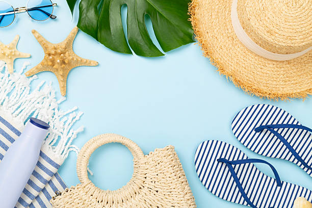 istock Blue beach accessories on color background, top view. Copy space for text 2224089526