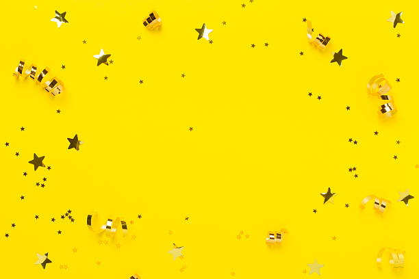 istock Golden confetti on color background, top view 2224090067