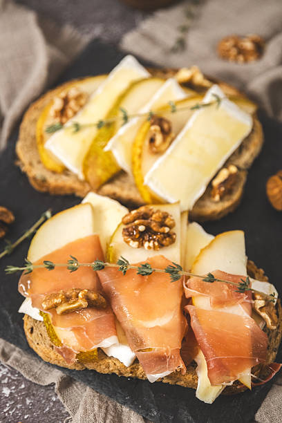 istock Tray with delicious sandwiches on the table. 2224091908