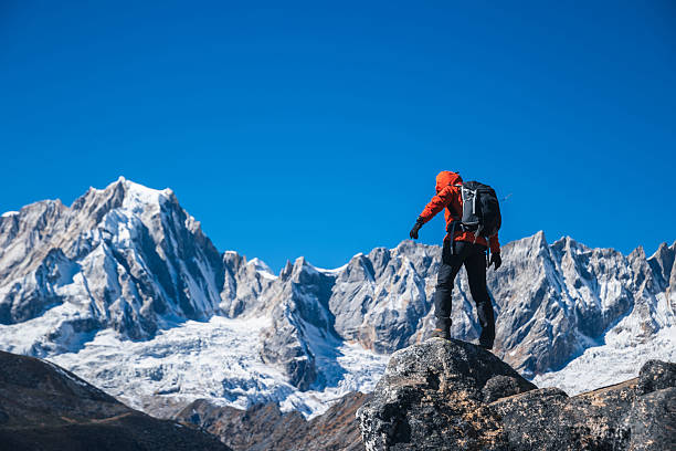istock Backpacking woman hiking on high altitude mountain top 2224092312