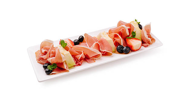 istock Delicious charcuterie platter featuring prosciutto with berries and mint 2224094078