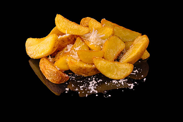istock Crispy potato wedges with cheese served on a reflective surface 2224094231