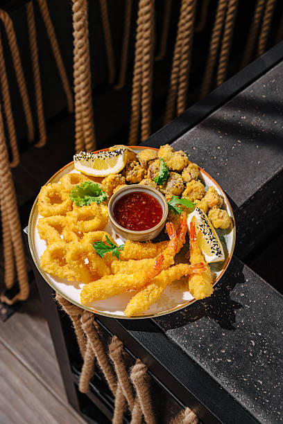 Crispy fried seafood platter served with tangy dipping sauce