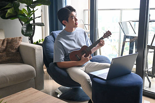 istock In-House Harmony: Ukulele Playing in the Living Room 2224098201