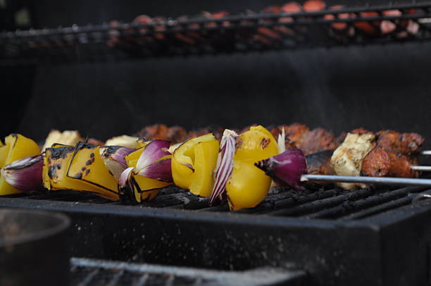 A classic summer-time family barbecue featuring meats and vegtables, captured on an island in the Swedish archipelago.