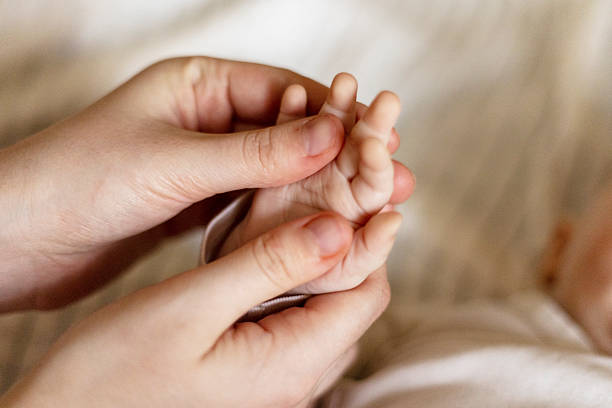 istock Infant Hand Massage with Gentle Finger Touch 2224102765