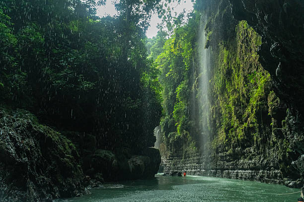 istock Wide shot of a river cave and cliffs in Green Canyon, Pangandaran, West Java, Indonesia. One of the most famous tourist attractions in West Java. 2224106120