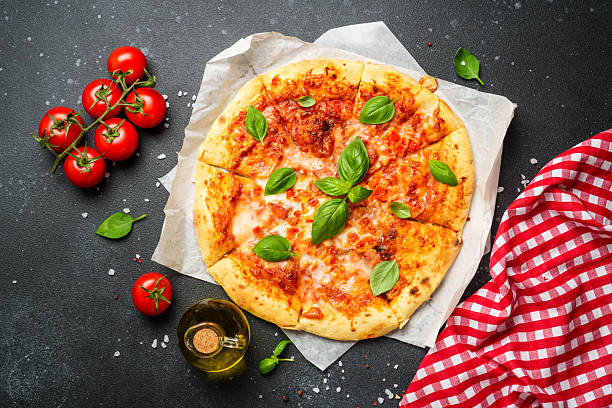 istock Pizza margarita on black background with ingredients for cooking. 2224108222