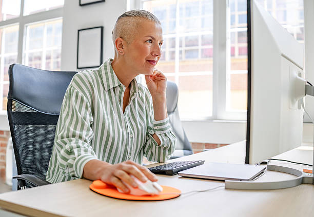 istock Focused businesswoman at workstation 2224108777