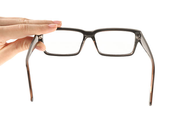 istock Woman holding glasses with black frame on white background, closeup 2224109310