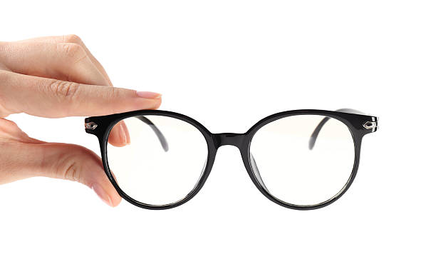 istock Woman holding glasses with black frame on white background, closeup 2224109311