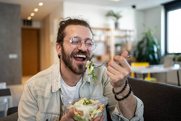 istock Cheerful freelancer enjoying healthy lunch break at home 2224109694