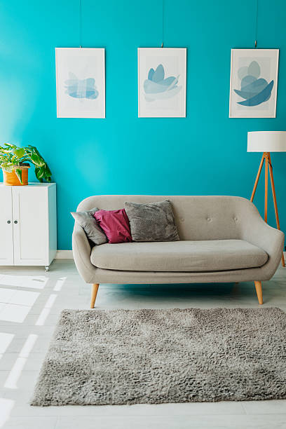 istock Modern living room with teal accent wall 2224110032