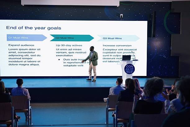 istock Professional Speaker Discussing Business Goals at a Conference Setting 2224110699