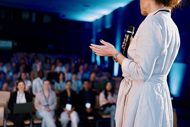 istock Close-Up of Speaker’s Gesture While Addressing Crowd at Event 2224110849