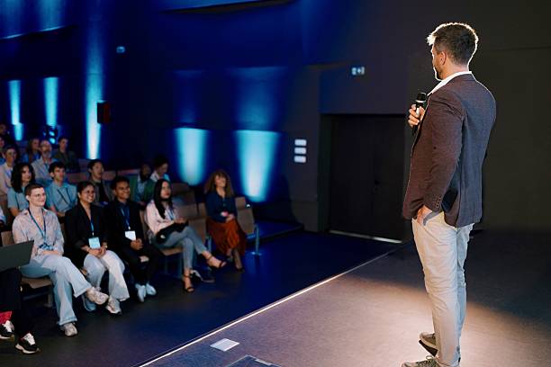 istock Confident Presenter Speaking to Engaged Audience at a Professional Conference Event 2224110854