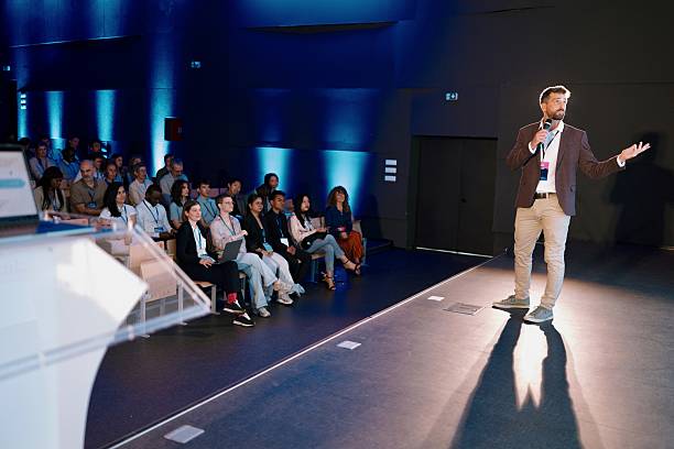 istock Speaker Addressing Technology Audience at Modern AI Conference Session 2224110858