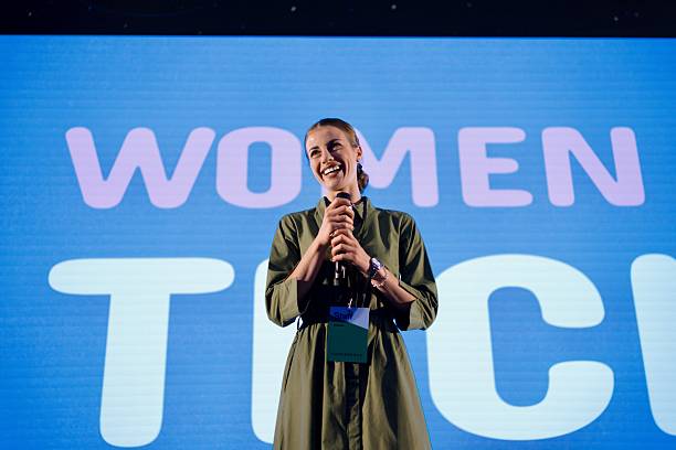istock Woman Moderating Conference Session Alone on Stage 2224110919