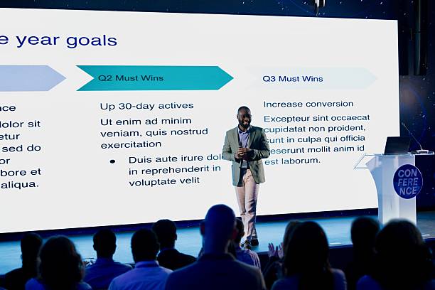 istock Speaker Discussing Innovation and Goals During a Modern Business Conference Presentation 2224111007