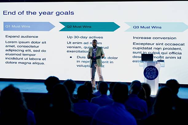 istock Professional Speaker Presenting Goals at a Modern Business Conference 2224111008