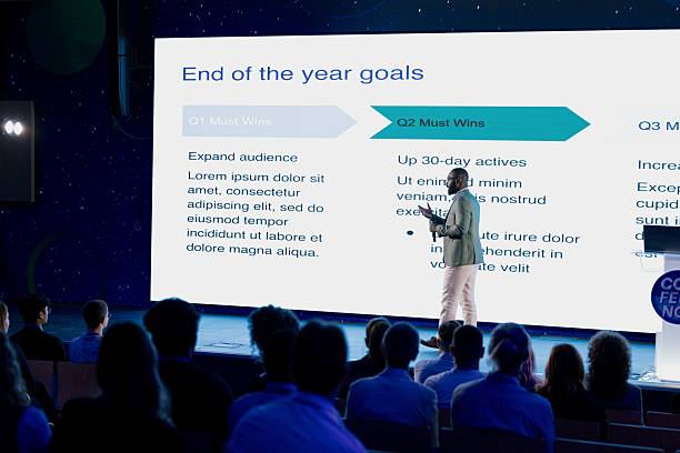 Professional Speaker Presenting at a Tech Conference in Advanced Business Environment