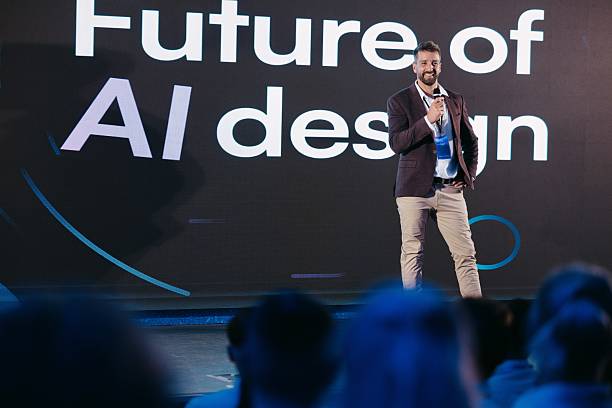 istock Confident Speaker Discussing AI Design at a Technology Conference on Stage 2224111099