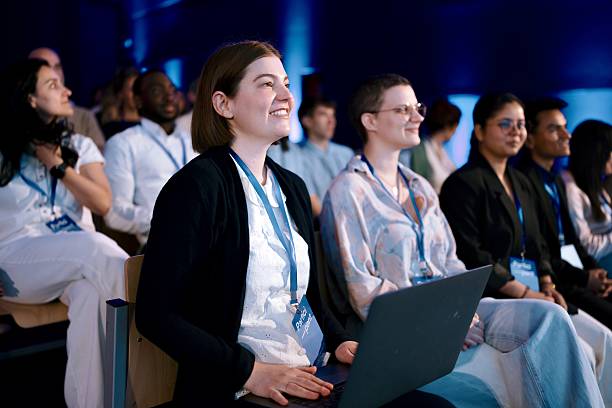 istock Diverse Professionals Attending a Business Conference in a Modern Venue 2224111107