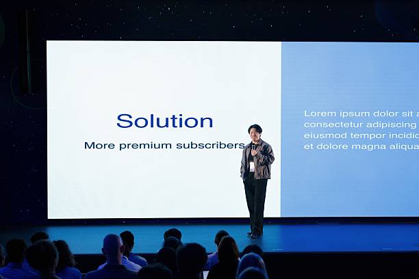 istock Young Speaker Presenting Innovative Solutions at Tech Conference on Modern Sustainable Futures 2224111157