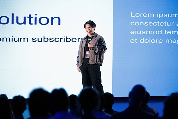 istock Young Speaker at Technology Conference Discussing Innovation and Sustainability on Stage 2224111168