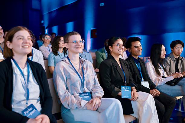 istock Diverse Attendees Engaged in a Business Conference in a Modern Auditorium Setting 2224111208