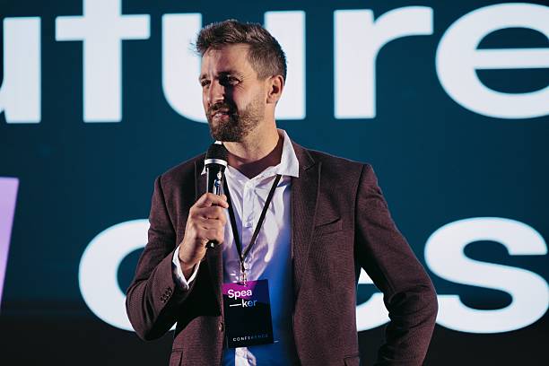 istock Confident Speaker Discussing Future AI Design at a Technology Conference 2224112989