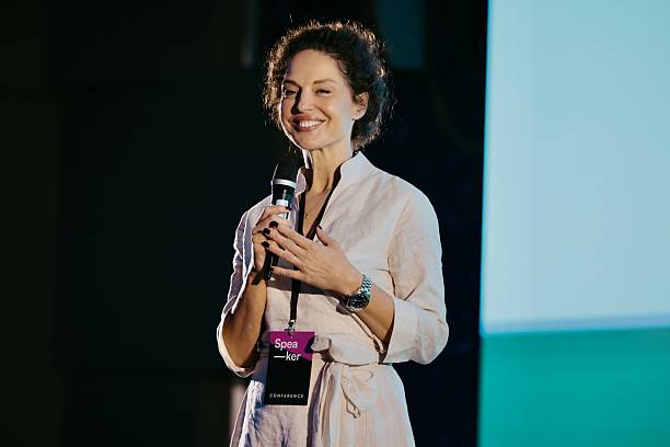 istock Smiling Speaker Addressing Audience at a Professional Technology Conference Event 2224113028
