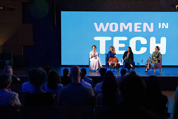 istock Women Discussing Innovation and Diversity in Technology During Corporate Panel Event 2224113747