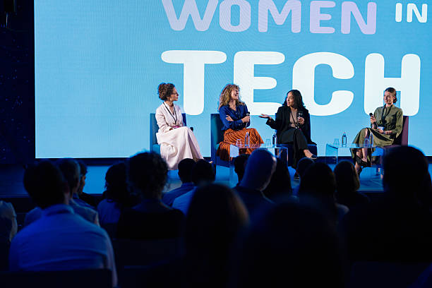 istock Diverse audience listening closely to lively panel discussion at tech conference 2224114045