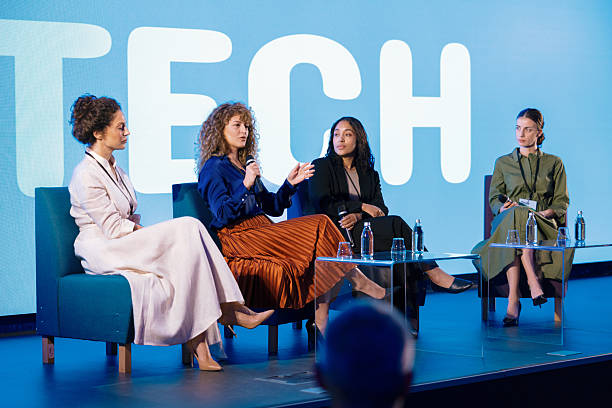 istock Multiracial Female Panelists Sharing Expertise at Technology Conference 2224114090