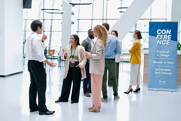 istock Business professionals interacting with each other during networking event at conference 2224118791
