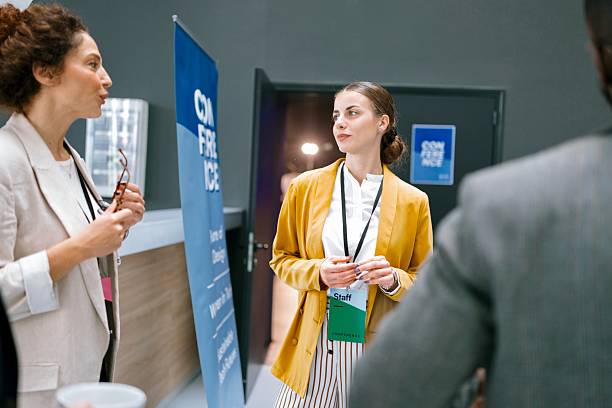 istock Business conference attendees socializing during break 2224118792