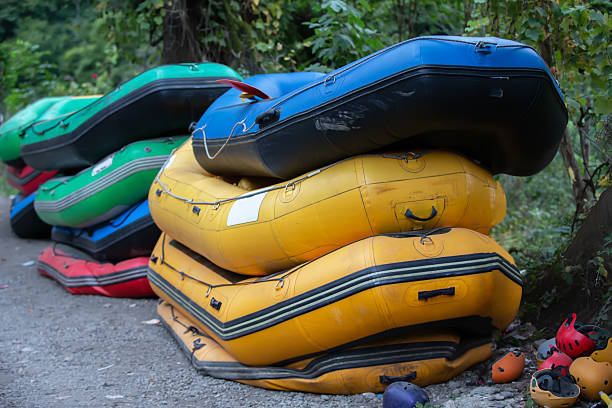 Rubber boats and helmets for rafting. Active recreation during travel