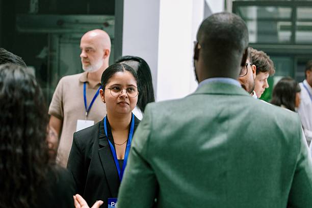 istock Business people enjoying conversation with diverse colleagues during break from conference 2224118870
