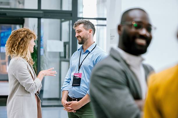 istock Business people enjoying conversation with diverse colleagues during break from conference 2224118912