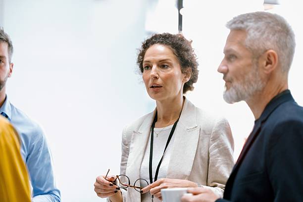 istock Diverse business professionals networking during conference break 2224118974
