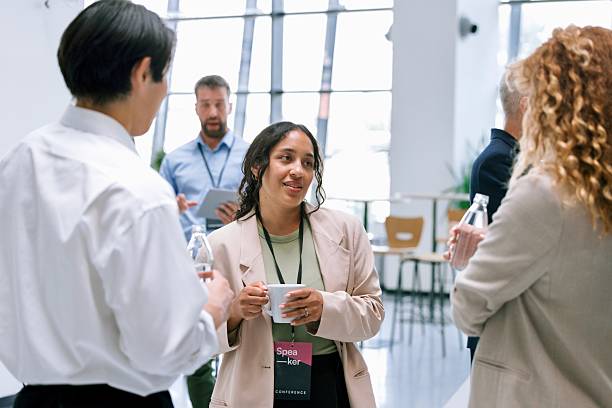 istock Business professionals interacting with each other during networking event at conference 2224119352