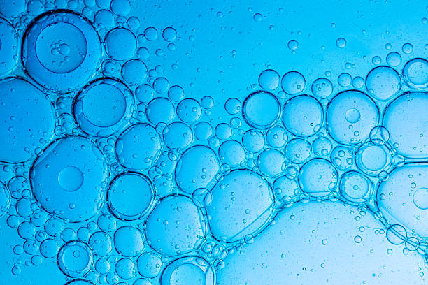 istock Blue macro science bubbles,Close-Up on Blue Bubbles in a Liquid, Abstract Background,Laboratory Petri dishes with liquid and pipette. Abstract scientific research concept. 2224119856