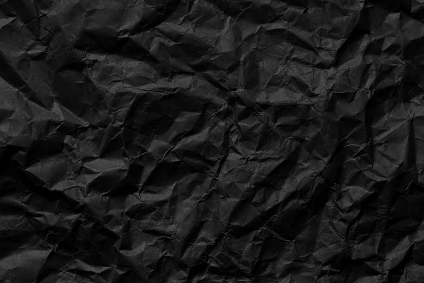 istock Close-up macro of black crumpled paper texture,black crumpled paper texture pattern,Background of black crumpled paper close up macro,black crumpled paper texture pattern 2224119964